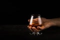 Man hold Cognac or brandy glass in his hand. Royalty Free Stock Photo