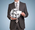 Man hold empty card and jigsaw puzzle sphere Royalty Free Stock Photo