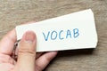 Man hold the flash card with handwriting word vocab Royalty Free Stock Photo