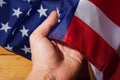 Man hold in hand American flag. Patriot, national event celebration, pride, usa citizen concept