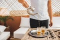 Man hold in hand silver vintage teapot and pouring traditional mint moroccan tea Royalty Free Stock Photo