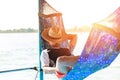 A man hold hat and sleep on hammock near the river. Royalty Free Stock Photo