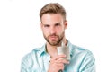 Man hold perfume bottle. Bearded man with deodorant isolated on white background. Fashion cologne bottle. Hygiene and Royalty Free Stock Photo