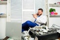 Man hold plastic bank card. Man successful businessman phone conversation ask service. Businessman rich bearded guy sit Royalty Free Stock Photo