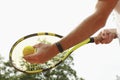 Man hold racket and tennis ball sky Royalty Free Stock Photo
