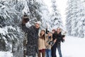 Man Hold Smart Phone Camera Taking Selfie Photo Friends Smile Snow Forest Young People Group Outdoor Royalty Free Stock Photo