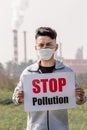 Man hold stop pollution sign