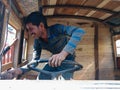 a man holded truck steering at workshop in india dec 2019 Royalty Free Stock Photo