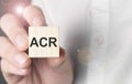 Man holding acr word on wooden cube Royalty Free Stock Photo