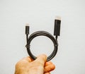 Man holding USB-C to DVi video cable