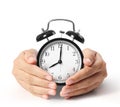 Man holding alarm clock in hands Royalty Free Stock Photo