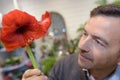 Man holding amaryllis lily