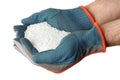 Man holding ammonium nitrate pellets on white background, closeup. Mineral fertilizer