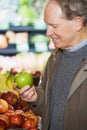 A man holding an apple Royalty Free Stock Photo