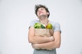 Man holding a bag full of groceries Royalty Free Stock Photo