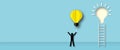 Man holding balloon light bulb with stair on pastel blue background. Ideas inspiration concepts of business finance.