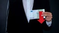 Man holding banknotes, euro falling, financial forecast, economic crisis