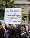 Man holding a banner and protesting