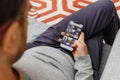 Man holding Barack Obama instagram photos on the new Apple iPho