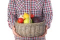 Man holding basket full of fresh  vegetables and fruits against white background Royalty Free Stock Photo