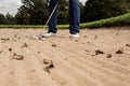 A man holding a bat on top of a dirt field Royalty Free Stock Photo