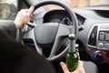 Man holding beer bottle while driving Royalty Free Stock Photo