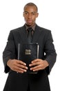 Man holding a bible showing commitment