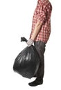 Man holding black plastic trash bag in his hand Royalty Free Stock Photo