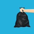 Man holding black plastic trash bag in his hand Royalty Free Stock Photo