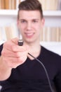 Man holding black USB cable Royalty Free Stock Photo