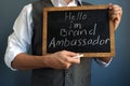 Man holding blackboard with sign I am Brand Ambassador Royalty Free Stock Photo