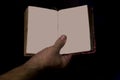 man holding blank book