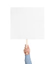 Man holding blank protest sign on white background, closeup Royalty Free Stock Photo