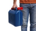 Man holding blue canister on white background