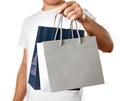 Man holding a blue and grey gift bags. Close up. Isolated on white background Royalty Free Stock Photo