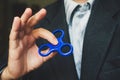 A man holding a blue spinner. Royalty Free Stock Photo