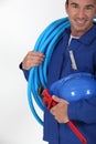 Man holding blue tube