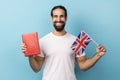 Man holding book and Great Britain flag, education, learning English language. Royalty Free Stock Photo