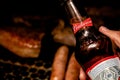 Man holding a bottle of Budweiser beer Royalty Free Stock Photo