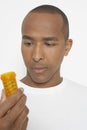 Man Holding Bottle Of Pills Royalty Free Stock Photo