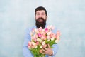 Man holding bouquet of flowers. womens day. Formal mature businessman. spring. 8 of march. bride groom at wedding party