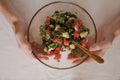 man holding a bowl of vegetable salad top view close-up Royalty Free Stock Photo