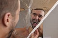 Man holding a broken mirror Royalty Free Stock Photo