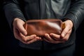 Man holding brown leather wallet in his hands,. Generative AI Royalty Free Stock Photo