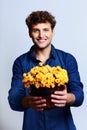 Man holding bucket with flowers Royalty Free Stock Photo