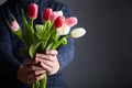 A Man holding bunch of tulips Royalty Free Stock Photo