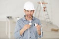 man holding cable plugs Royalty Free Stock Photo