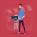 Man Holding Camera On Tripod Modern Video Blogger Filming Popular Vlog