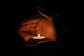 Man holding a candle in the dark Royalty Free Stock Photo