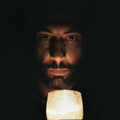 A man holding a candle Royalty Free Stock Photo